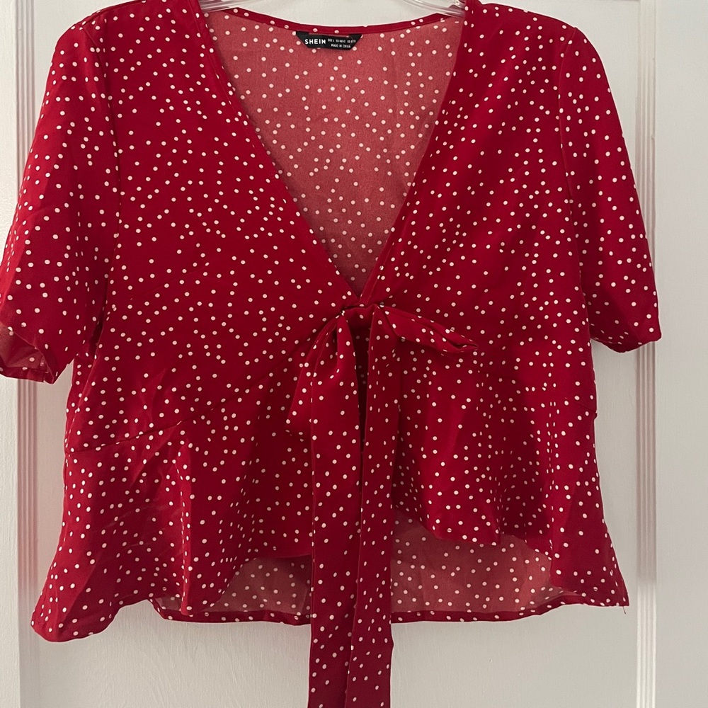 Tie front polka dot peplum top